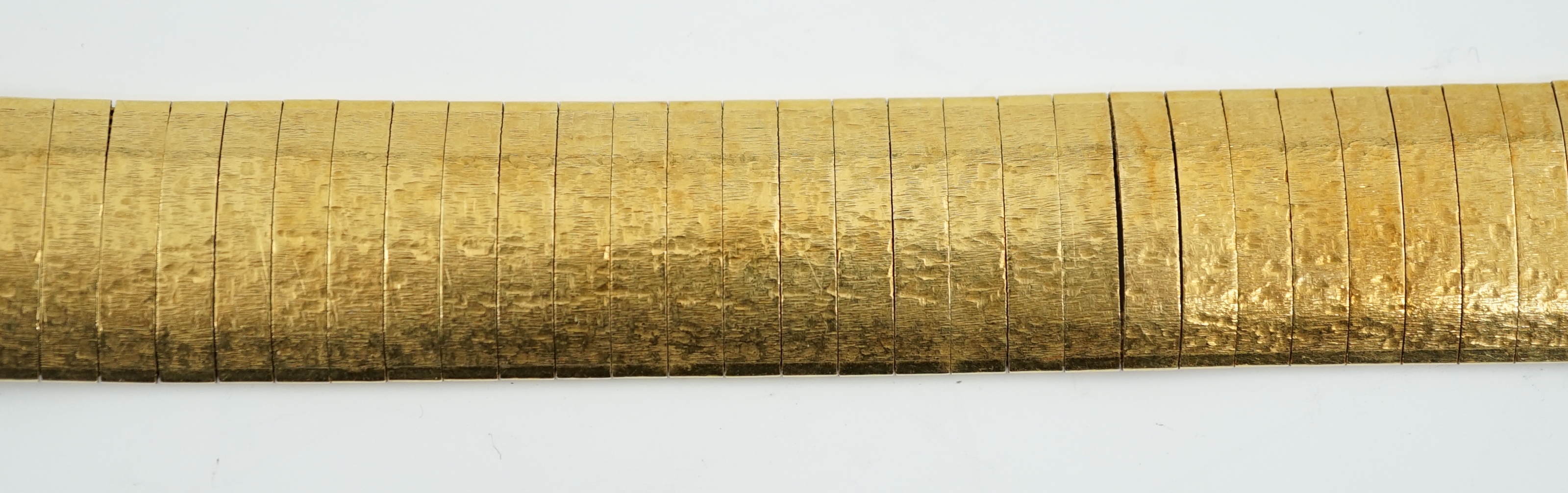 An Italian 18k gold textured flat link bracelet